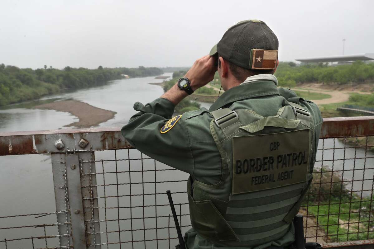 A U.S. Border Patrol agent scans the U.S.-Mexico border while on a bridge over the Rio Grande on March 13, 2017 in Roma, Texas. The Border Patrol has reported that illegal crossings from Mexico have dropped some 40 percent along the southwest border since Donald Trump took office. (Photo by John Moore/Getty Images)