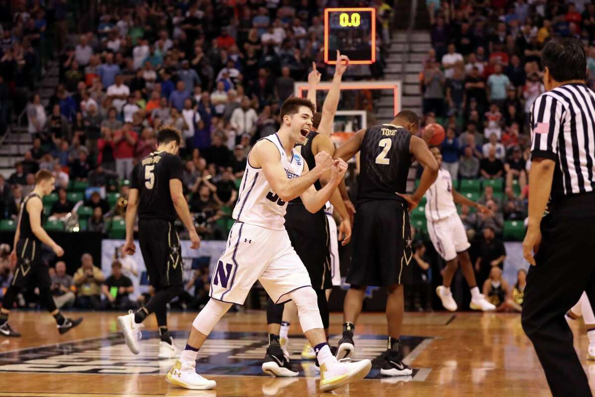 With 15 seconds left and down by one, Bryant McIntosh cannot believe his good fortune after the Northwestern guard was intentionally fouled by Vanderbilt's Matthew Fisher-Davis (5), who got his signals crossed. Coverage of Thursday's opening games on pages C2-3.