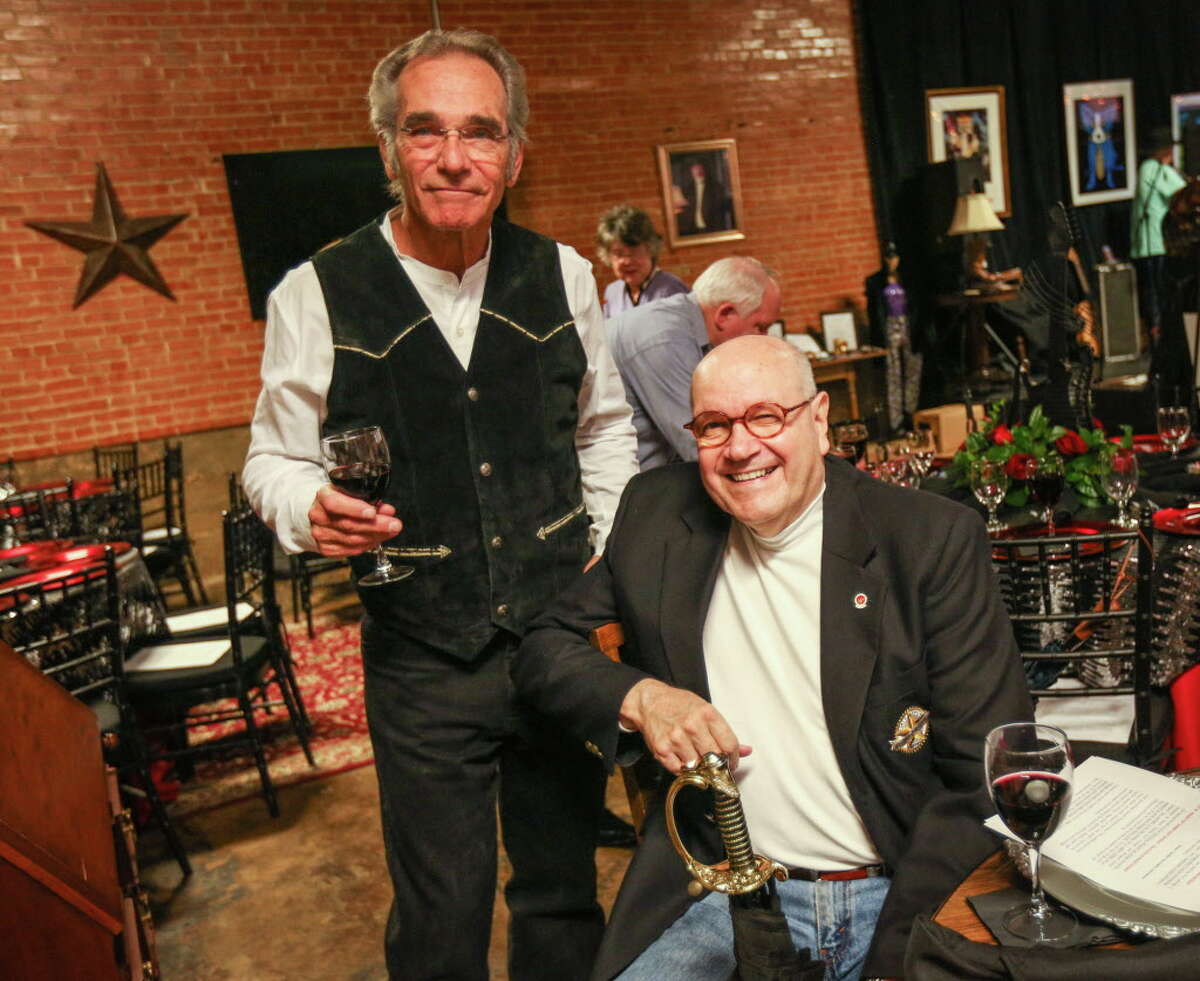 Don Hampton, left, and Dave Parsons, right, pose for a photo during the Bach, Beethoven & Barbecue gala prior to the Young Texas Artists Concert on Saturday, March 11, 2017, at Martin's Hall in downtown Conroe.
