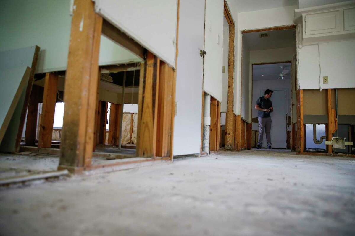 Christian Rumscheidt walks through his house Wednesday, March 8, 2017, which was undergoing repairs after it was flooded in April 2016. ( Michael Ciaglo / Houston Chronicle )