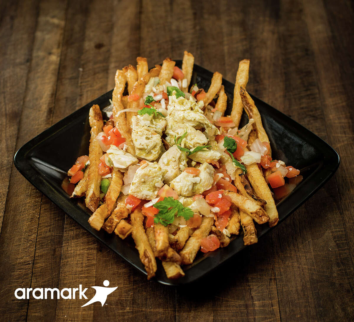 Green Chili Chicken Stak Minute Maid Park (Houston Astros) Fresh cut fries topped with green chicken chili, cotija cheese and pico de gallo.