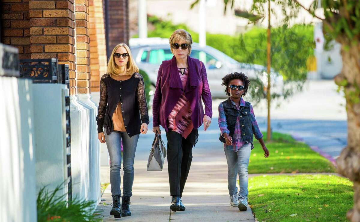 Obit writer Anne (Amanda Seyfried) hangs out with Harriet (Shirley MacLaine) and Brenda (Ann'Jewel Lee) in a scene from “The Last Word.”