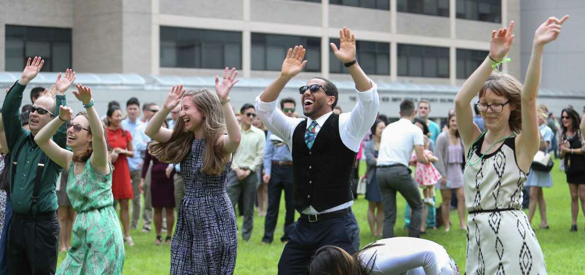 Fourth-year medical students at Baylor College of Medicine dance before they opened envelopes that reveal where they will continue their medical training for the next three to seven years Friday, March 17, 2017, in Houston. Match Day culminates the annual National Resident Matching Program, which pairs fourth-year medical students with residency programs throughout the nation.