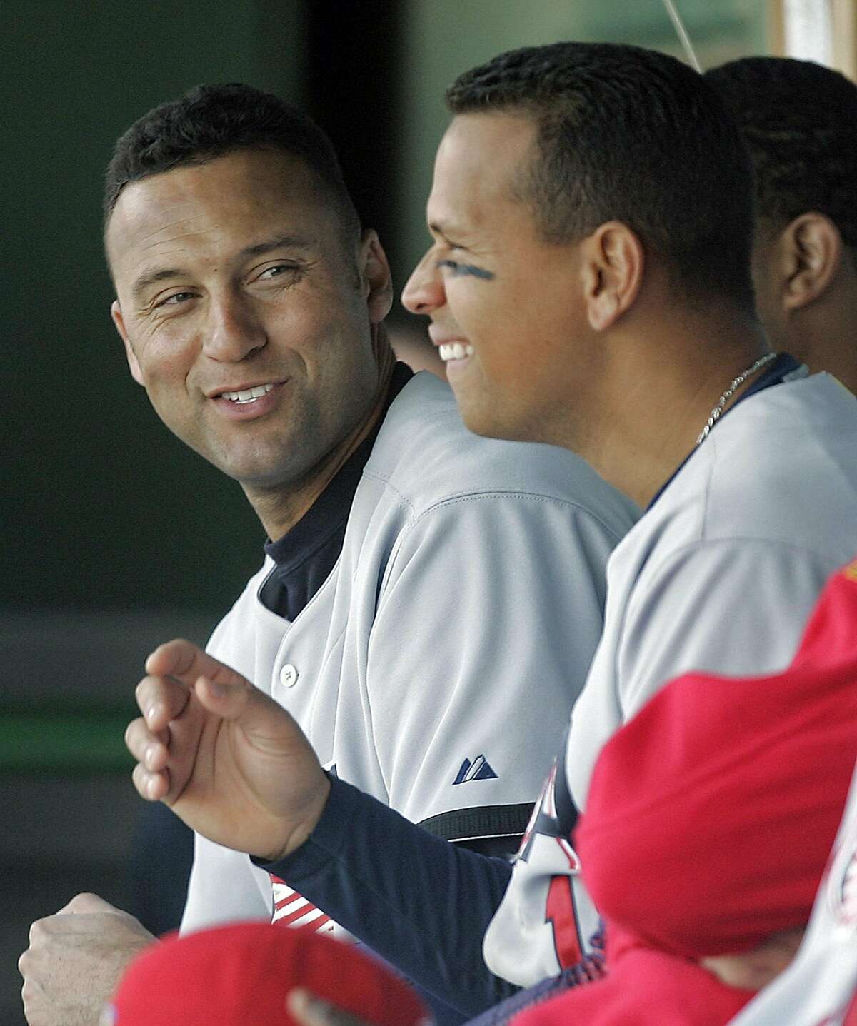 USA's Derek Jeter, left, and Alex Rodriguez share a moment in the dugout during the fourth inning of their Round 1 World Baseball Classic game against South Africa Friday, March 10, 2006 in Scottsdale, Ariz. USA won, 17-0. (AP Photo/Morry Gash)