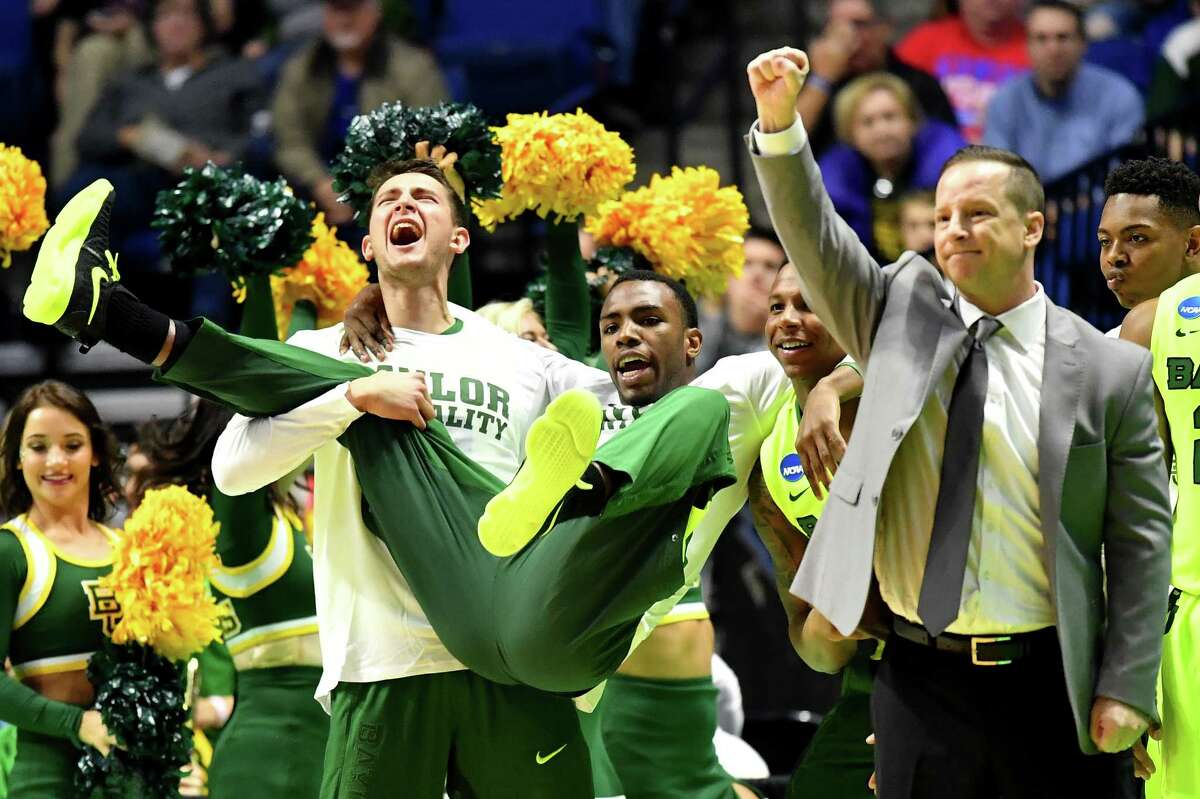 TULSA, OK - MARCH 17: The Baylor Bears bench celebrates in the second half against the New Mexico State Aggies during the first round of the 2017 NCAA Men's Basketball Tournament at BOK Center on March 17, 2017 in Tulsa, Oklahoma.