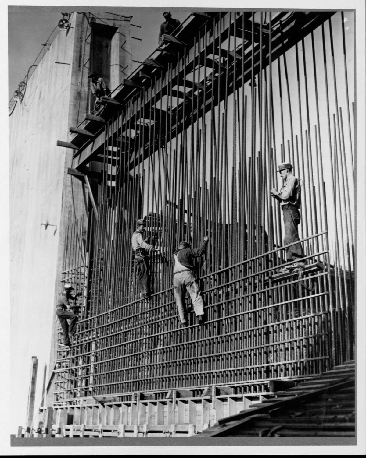 Construction workers build the steel rod frame of a wall in Grand Coulee Dam. November, 1937. (Photo by Library of Congress/Corbis/VCG via Getty Images)
