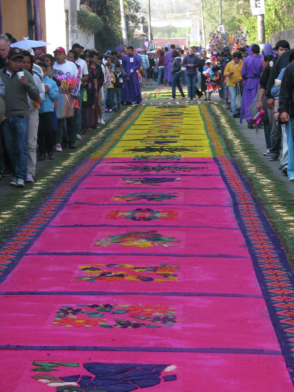 A block-long, intricately designed carpet made of colored sawdust ﻿﻿covers the route where religious processions pass during the Easter season.﻿