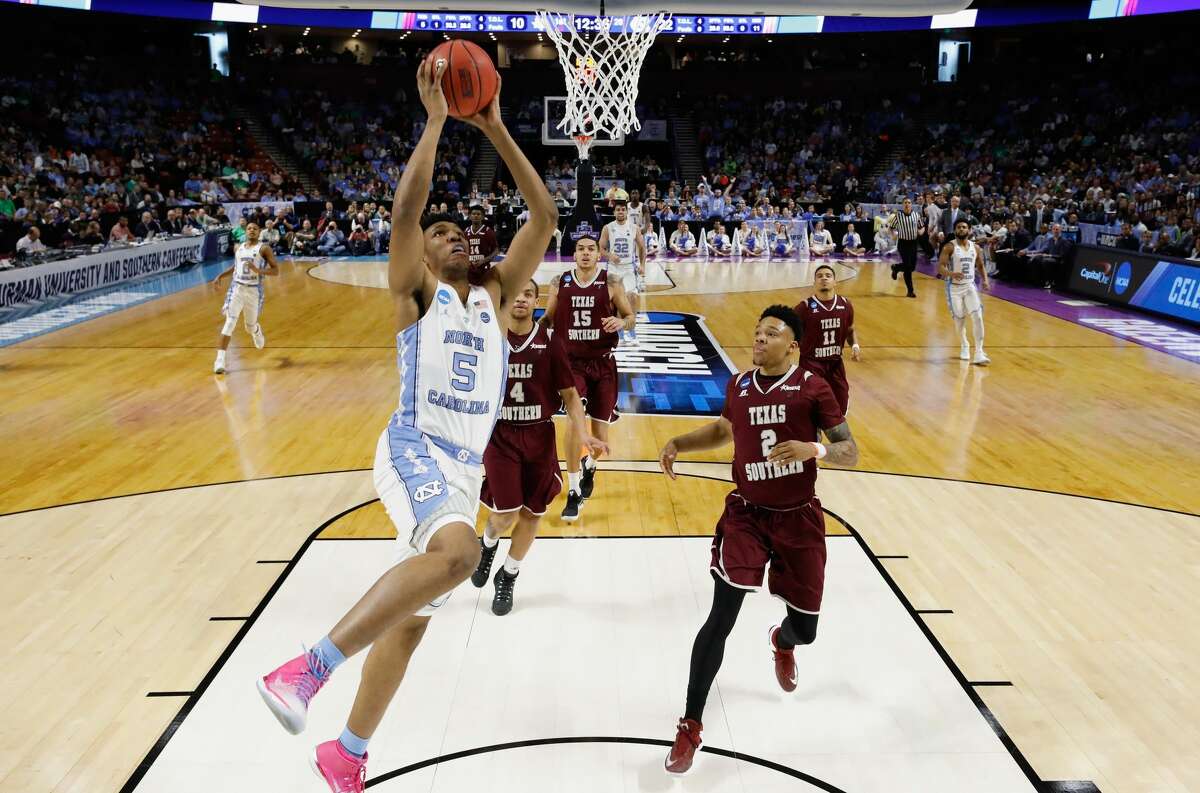GREENVILLE, SC - MARCH 17: Tony Bradley #5 of the North Carolina Tar Heels shoots against Zach Lofton #2 of the Texas Southern Tigers in the first half during the first round of the 2017 NCAA Men's Basketball Tournament at Bon Secours Wellness Arena on March 17, 2017 in Greenville, South Carolina. (Photo by Kevin C. Cox/Getty Images)