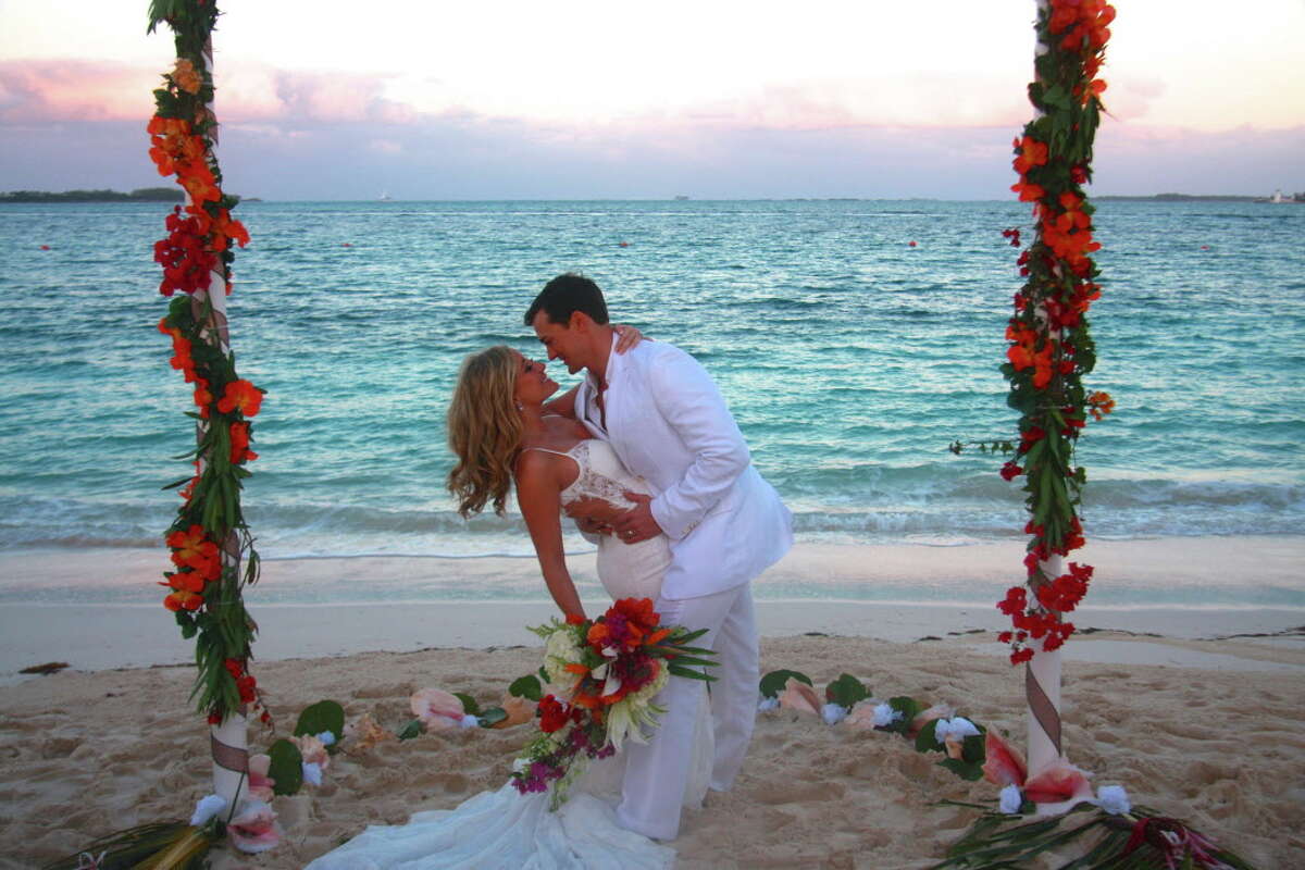 Rebecca and Will Shindler exchanged vows on the beach ﻿in the Bahamas.
