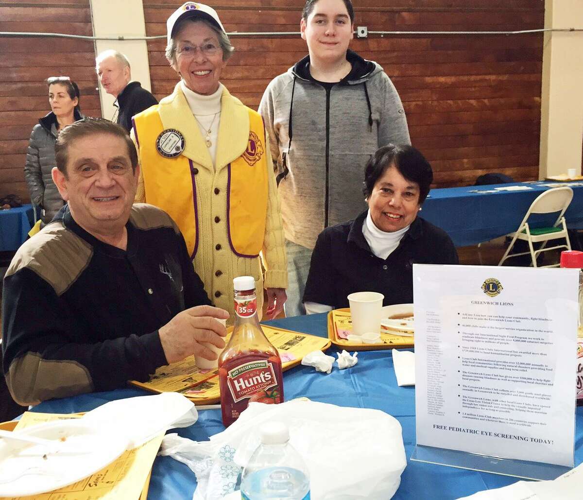 From left, Sam Romeo, Caroline Stafford, Daniel Thiverge and Mary Romeo enjoy the annual Lions Club Pancake Fry in Old Greenwich.