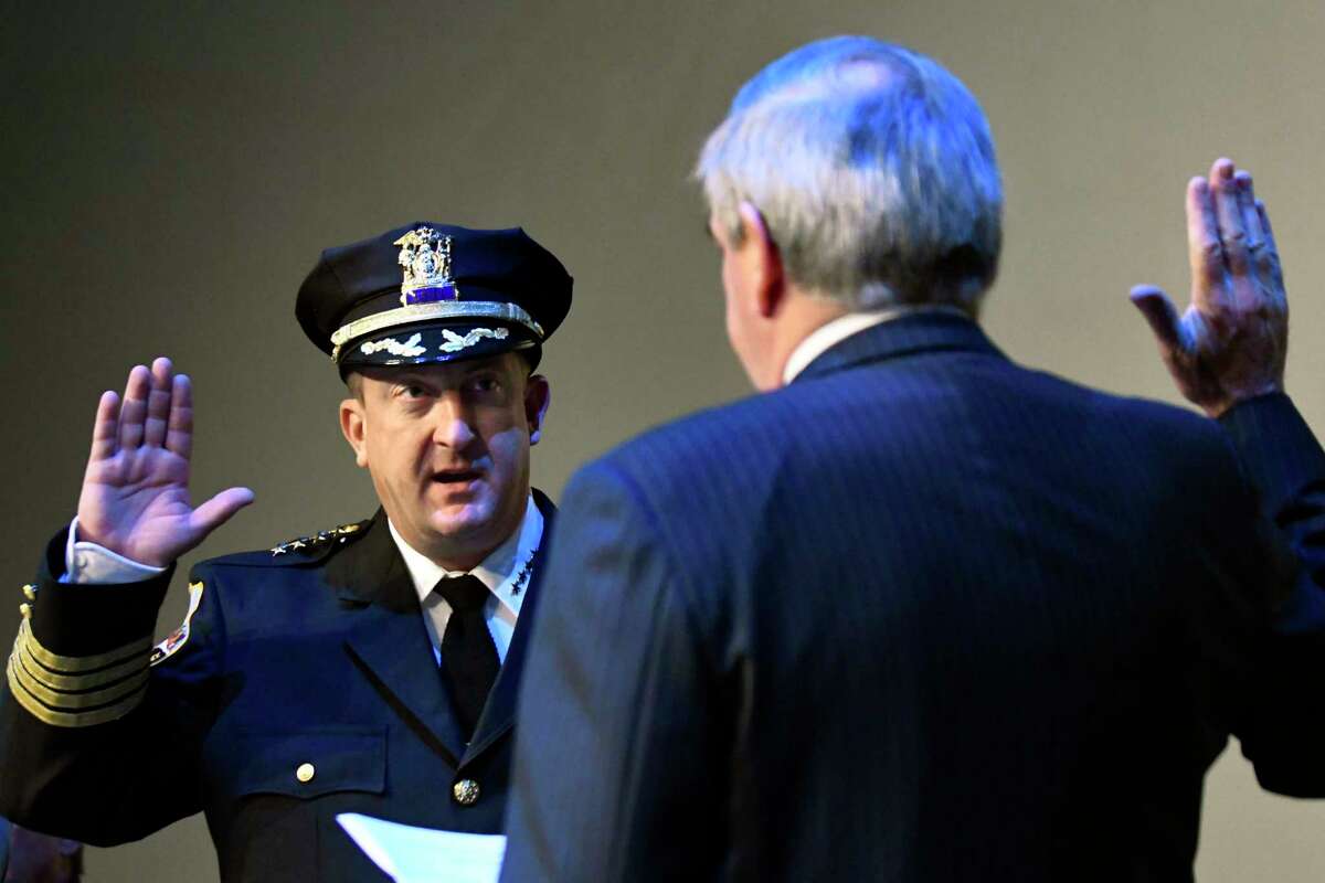 Police Chief Eric Clifford, left, takes the oath of office from Mayor Gary McCarthy during a ceremony on Tuesday, Sept. 13, 2016, at Proctors Theatre in Schenectady, N.Y. (Cindy Schultz / Times Union archive)