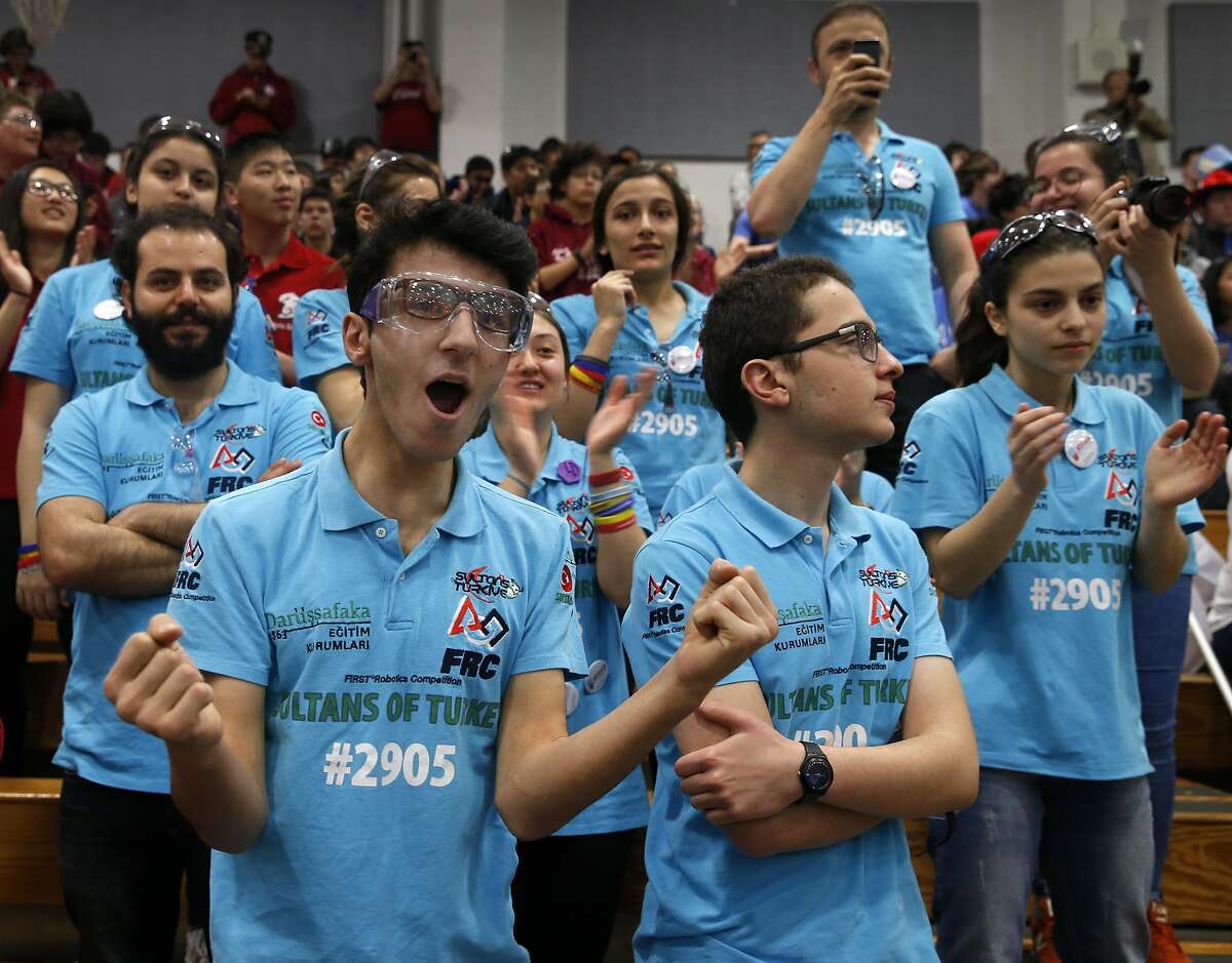 Seyhmus Aca (left) watches his Sultans of Turkey teammates compete in a qualifying match of the FIRST robotics competition at St. Ignatius College Prep in San Francisco, Calif. on Saturday, March 18, 2017. Forty-one schools and organizations, including three from Turkey, entered robots in the event.