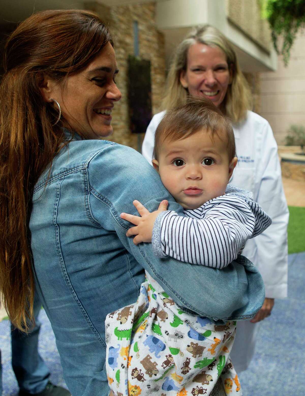 Ana Carla Cepeda and her six-month-old son, Bruno, meet with Dr. Barbara Held at Houston Methodist Hospital Texas Medical Center, Wednesday, March 8, 2017. Cepeda was diagnosed with early-stage cervical cancer in late 2014, but she wasn't ready to give up on having another child. After a relatively rare procedure by Dr. Anuj Suri, Cepeda gave birth to Bruno under Dr. Held's care in late 2016. ( Mark Mulligan / Houston Chronicle )