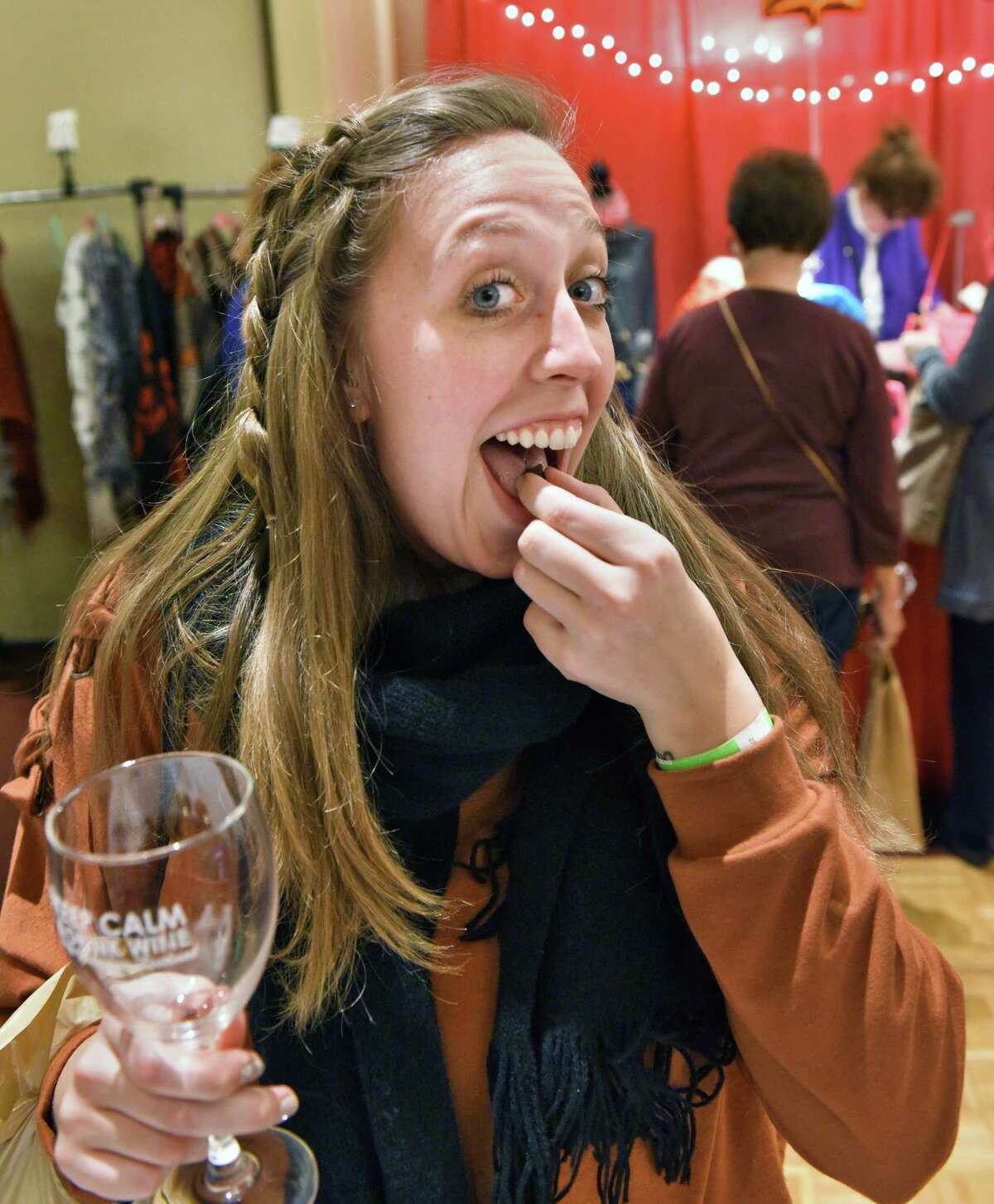Emily Pierce of Albany sample a Goufrais or German "Cool Treat" from Angelic Imports during the Albany Wine & Chocolate Festival Saturday March 18, 2017 in Colonie, NY. (John Carl D'Annibale / Times Union)