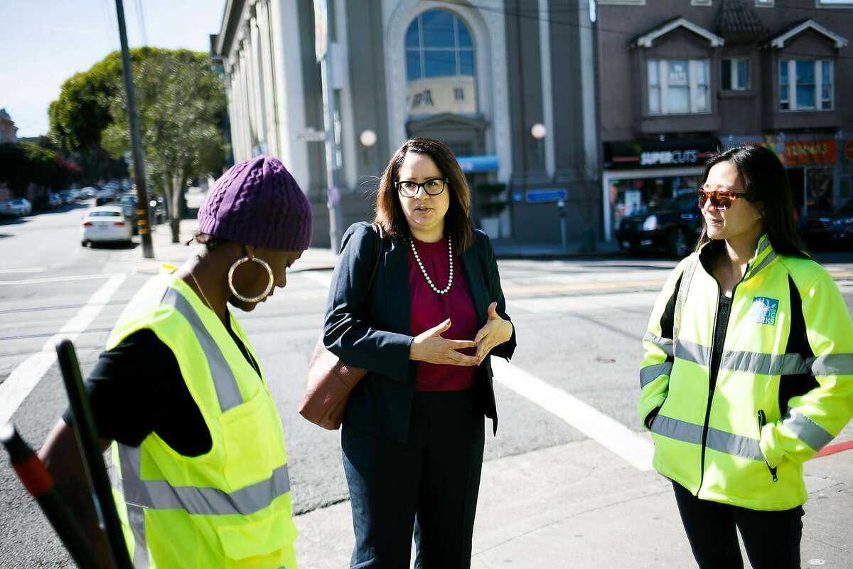 Fix-It Director, Sandra Zuniga, center, introduces Public Works Public Information Officer, Natalie Chen, right, to Fix-It employee, Safonya Crawford, in the Inner Sunset in San Francisco, Calif. Friday, March 17, 2017.