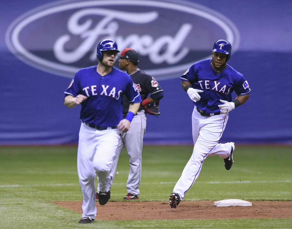 Steven Lerud leads teammate Cesar Puello of the Texas Rangers, who hit a three-run home run against the Cleveland Indians during Big League Weekend in the Alamodome on Saturday, March 18, 2017.