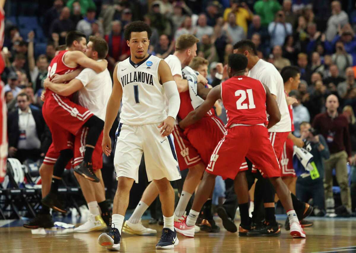 Villanova guard Jalen Brunson leaves the court in disbelief as Wisconsin players celebrate the end of their second-round upset. It marked the third defeat of a No. 1 seed for the Badgers in four years, after they beat Arizona in 2014 and Kentucky in 2015.