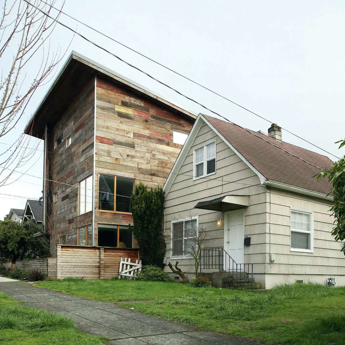 Seattle's changing a lot these days (pictured above: A two-bedroom house built in 1900 next to a modern three-bedroom built in 2015 on NW 61st Street in Ballard). But the quintessential "Seattle style" has had some mainstays over the years. (Genna Martin, seattlepi.com)