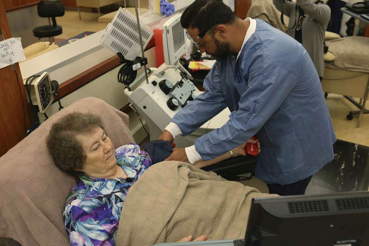 Robert Garza sets up Sister Anna Marie Vrazel, a nun with the Sisters of Divine Providence, as she donates blood at the South Texas Blood & Tissue Center, Monday, Feb. 20, 2017. Inspired by her father, Vrazel has donated blood since 1969.