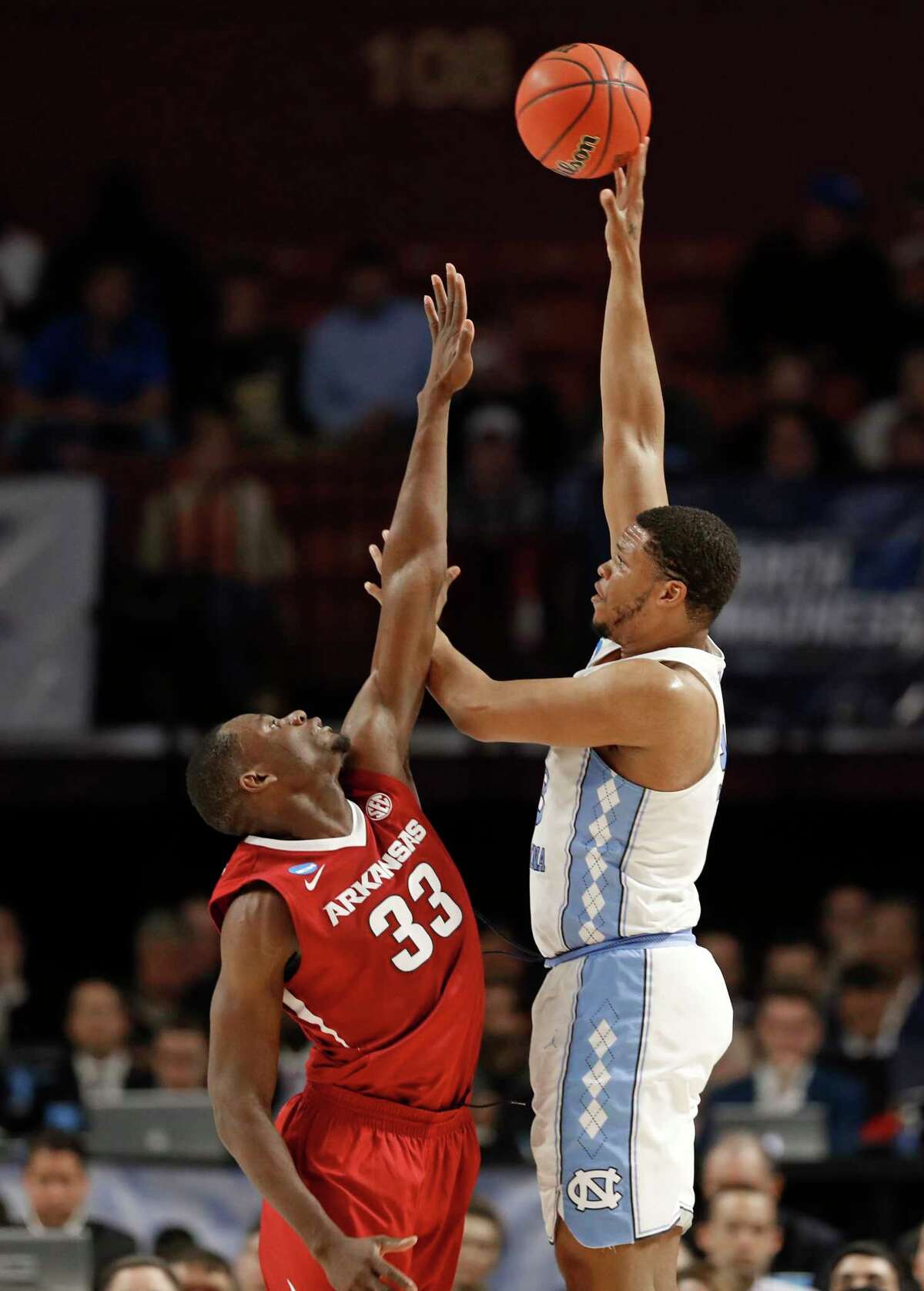 North Carolina's Kennedy Meeks, right, shoots over Arkansas' Moses Kingsley, left, during the first half in a second-round game of the NCAA men's college basketball tournament in Greenville, S.C., Sunday, March 19, 2017. (AP Photo/Chuck Burton) ORG XMIT: SCCB118