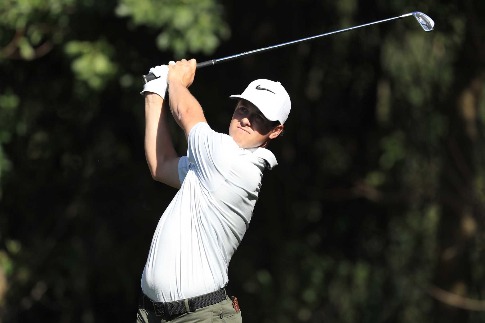 Video: Texas professional golfer nudges gator into water with his hand