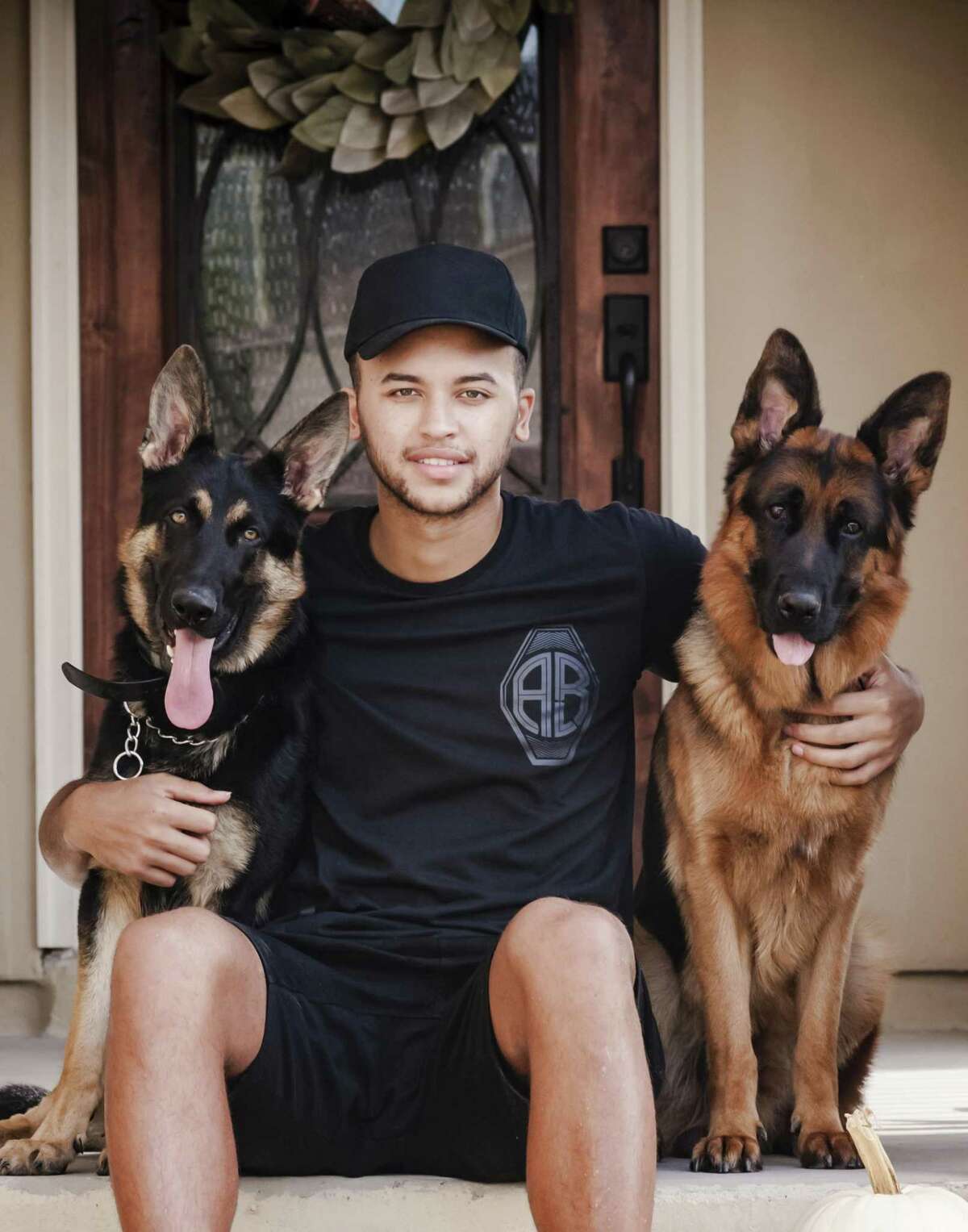 Spurs’ Kyle Anderson poses with his German Shepherds, Steel and Nino.