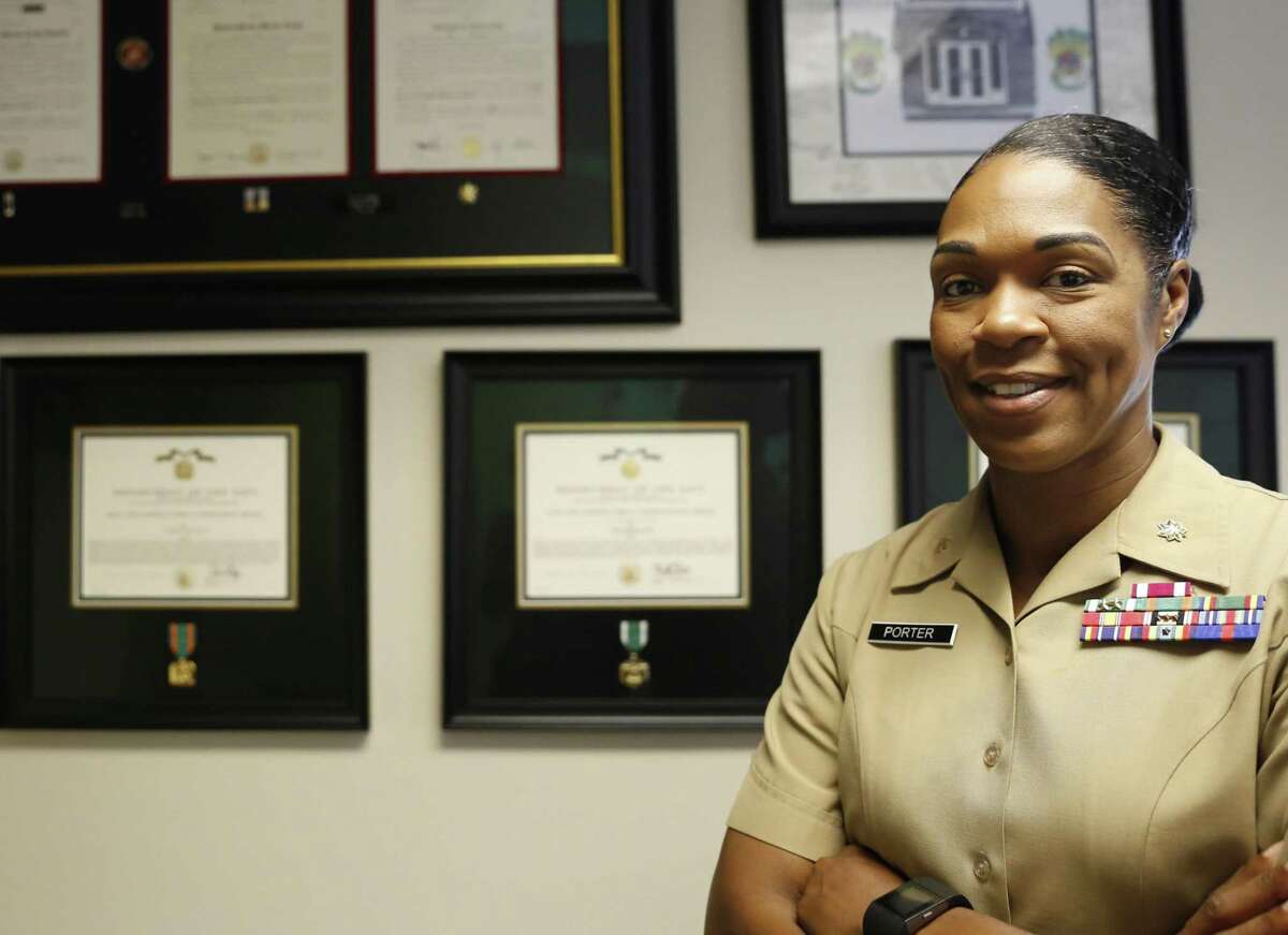 In this Aug. 5, 2016 photo, Maj. Shanelle Porter, commanding officer at the Recruiting Station Chicago poses in her office in Des Plaines, Ill. The U.S. Marine Corps is looking for a few more good women. And this time the campaign?’s a bit different. Marine recruiters are turning to girls high school sports teams to find candidates who may be able to meet the Corps?’ rigorous physical standards _ including for front-line combat jobs now open to women. (AP Photo/Tae-Gyun Kim)