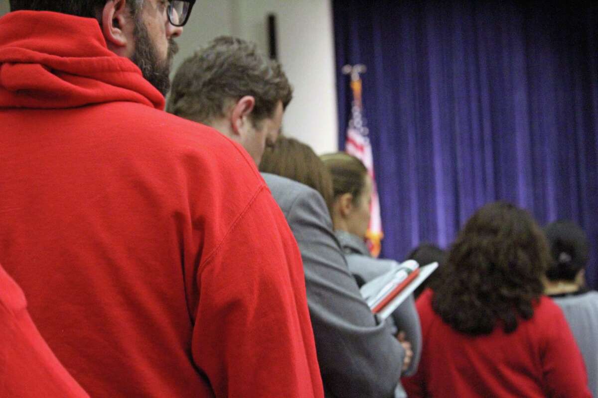 Residents wait in line Saturday to air their opinion on the proposed $308 million municipal budget.