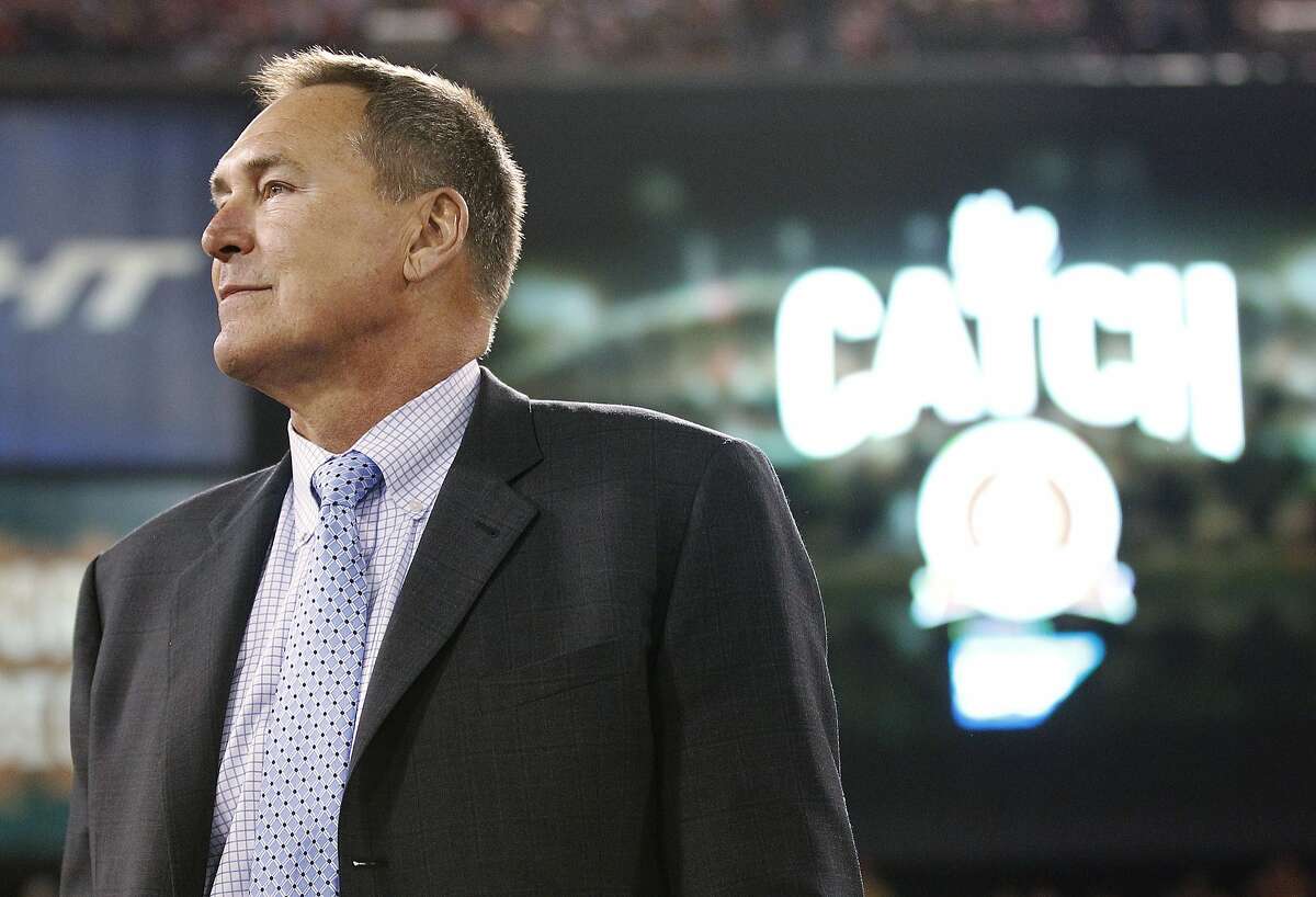 In this Dec. 23, 2013, file photo, former San Francisco 49ers wide receiver Dwight Clark is honored at halftime of an NFL football game between the 49ers and the Atlanta Falcons in San Francisco. Clark stands near the spot where he made a catch so famous it is referred to as "The Catch." Clark says he has Lou Gehrig?’s disease and suspects playing football might have caused the illness. Clark announced Sunday, March 19, 2017. on Twitter that he has amyotrophic lateral sclerosis, a disease that attacks cells that control muscles. Clark linked to a post on his personal blog detailing his ALS diagnosis, but the site crashed Sunday night, apparently from an overflow of traffic. 