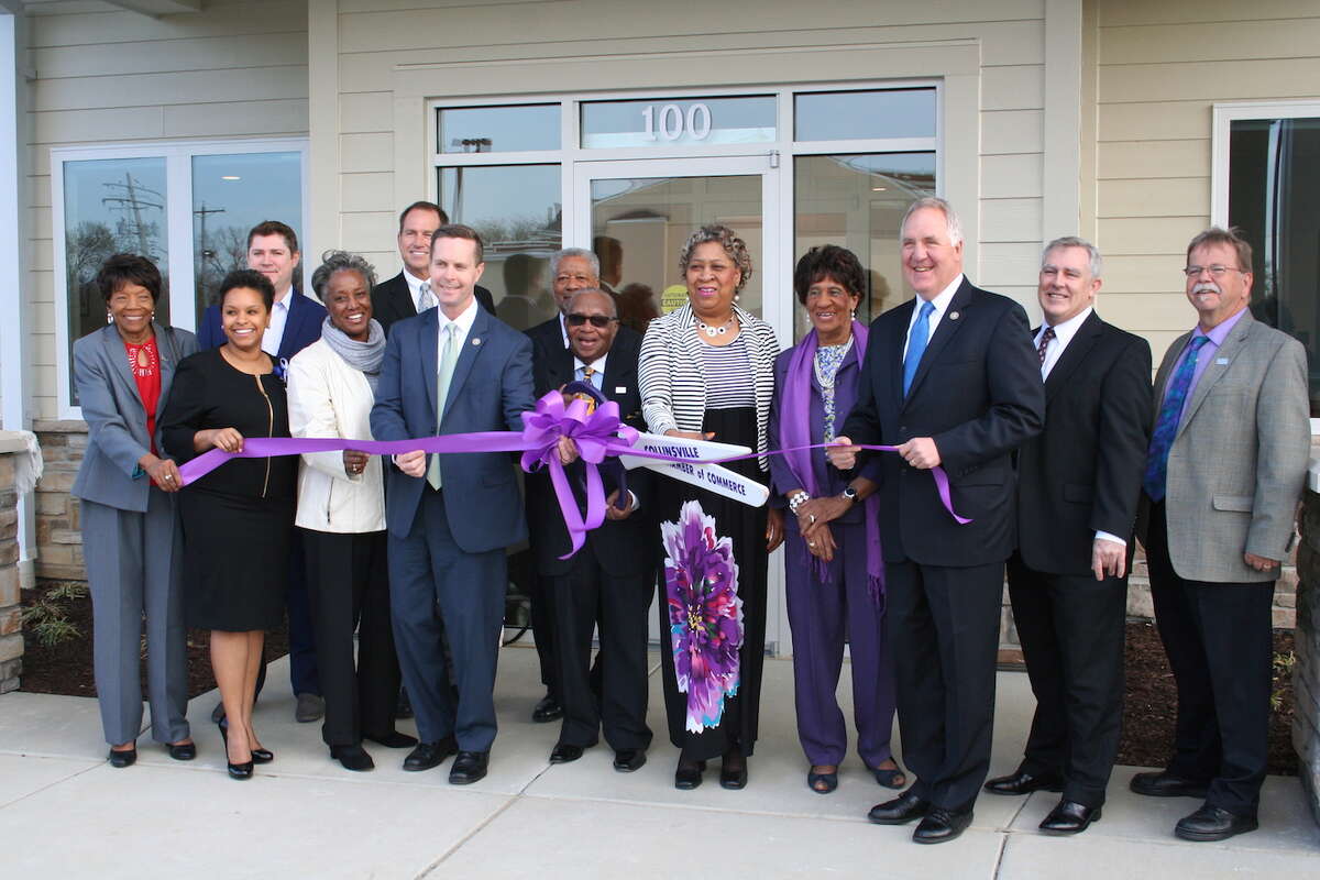 Congressmen John Shimkus and Rodney Davis help the board of directors of Southern Illinois Healthcare Foundation and staff cut ribbon at New Health Center now open at 1215 Vandalia St. in the heart of Collinsville.