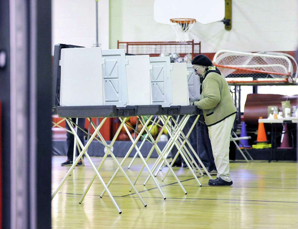 A voter casts her ballot in the gymnasium inside New Lebanon School in 2015. The League of Women Voters is co-sponsoring a discussion on a national move to circumvent the Electoral College and award the presidency to the person who garners the most votes. The discussion is set for 7 p.m. April 4 at the Greenwich Library, 101 W. Putnam Ave. Free and open to the public.