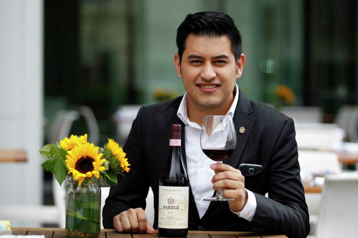 Andres Blanco poses for a portrait with his favorite wine Barolo 2006 on Friday, Feb. 10, 2017, in Houston. ( J. Patric Schneider / For the Chronicle )