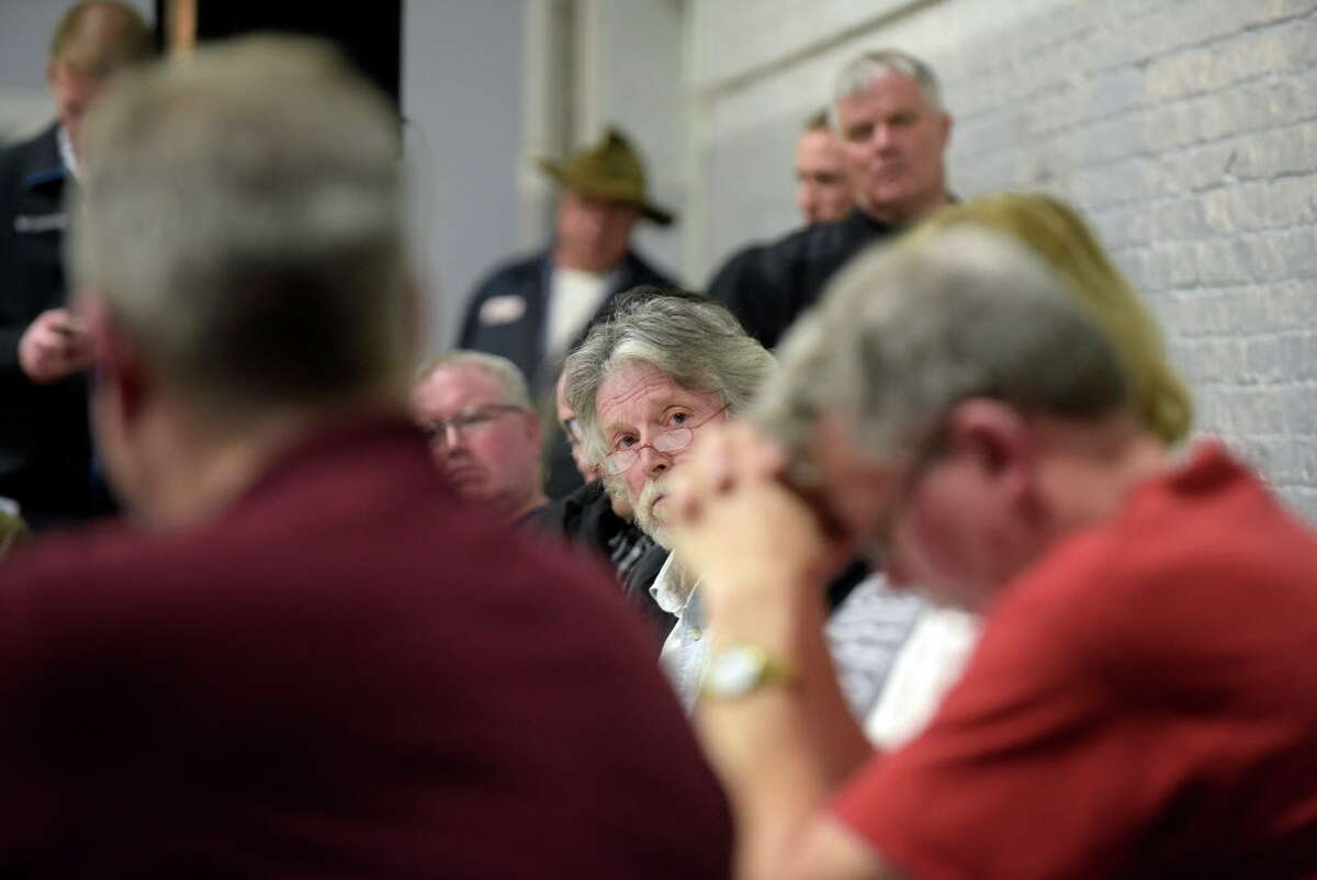 Hoosick Falls Mayor David Borge, center, and Village Board Members listen to residents speak in opposition to a revised proposed PFOA settlement during a board meeting on Monday, Feb. 27, 2017, in Hoosick Falls, N.Y. (Paul Buckowski / Times Union)