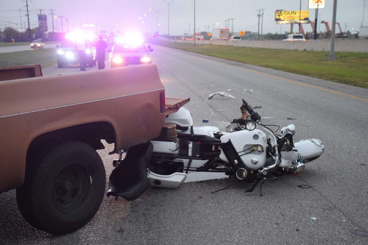 A motorcyclist suffered life-threatening injuries Tuesday morning after he drove into the back of a pickup truck on Loop 410 while trying to avoid an 18-wheeler.