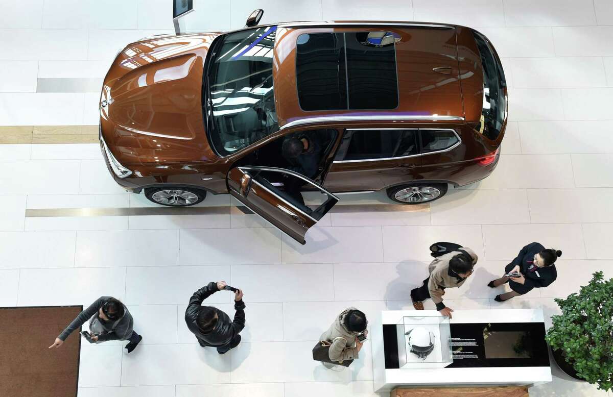 A BMW is displayed before the company's annual news conference Tuesday in Munich, southern Germany. After spending about $5.6 billion, or 5.5 percent of its revenue, on research and development last year, BMW will invest at an even higher rate in the coming two years.
