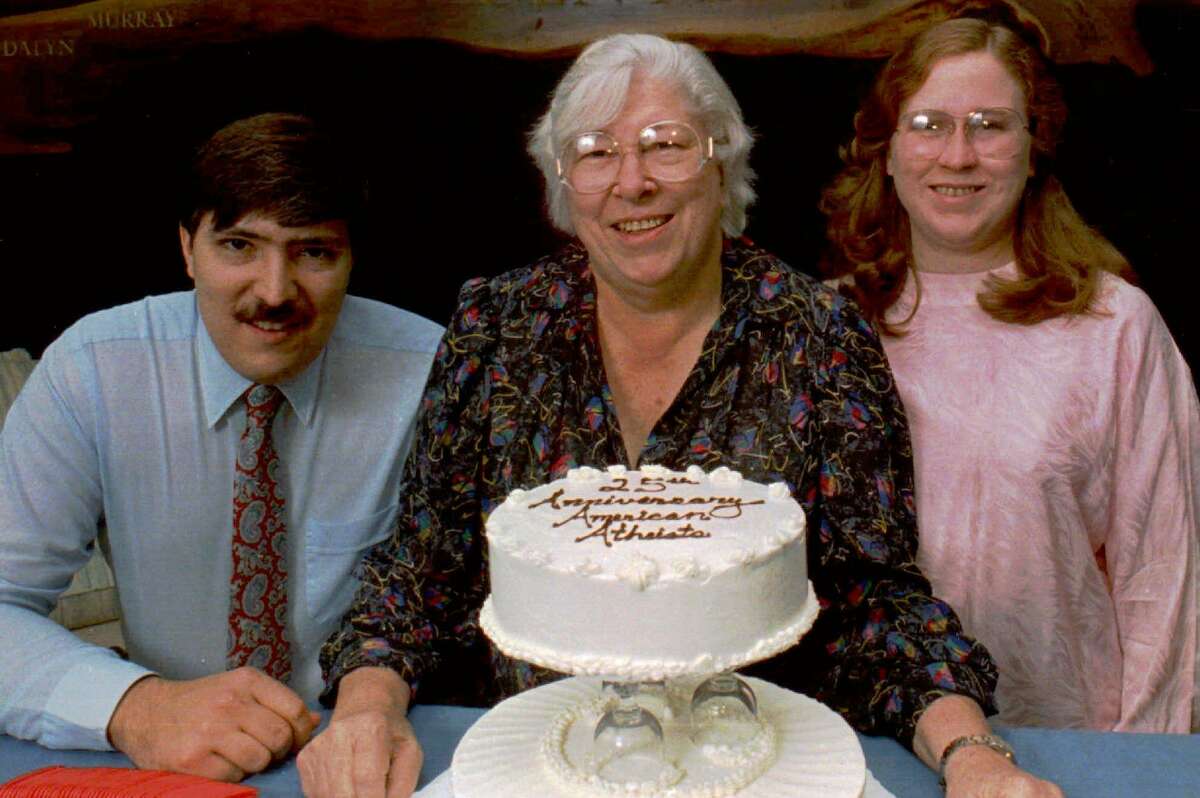 FILE--Atheist Madalyn Murray O'Hair, center, sits with son, Jon, left, and granddaughter Robin Murray-O'Hair, adopted as her own daughter, in Austin, Texas, in this June 1988 file photo. Gary Karr, an ex-convict, was convicted of conspiring to rob Madalyn Murray O'Hair and her family, but was found innocent of kidnapping the three, who disappeared in 1995 and are believed to have been killed and dismembered. (AP Photo/David Breslauer, File)