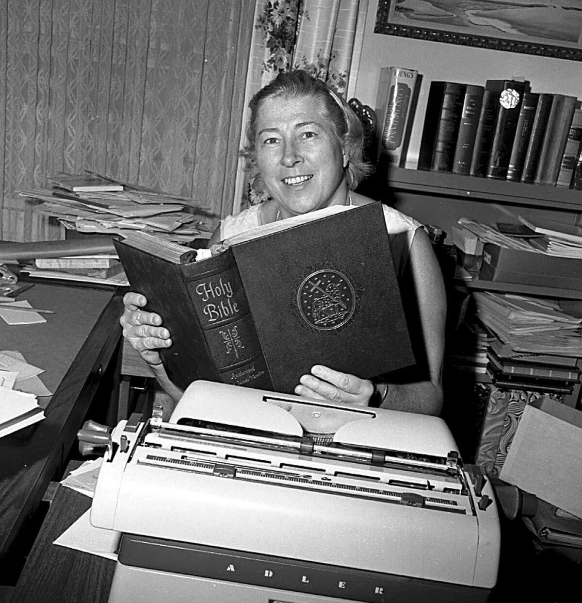 The real atheist leader Madalyn Murray O'Hair. She holds a copy of the Bible in her office in this Dec. 3, 1969 file photo.