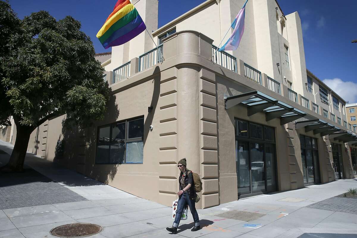 A rainbow flag flies from the corner of restored Richardson Hall where Laguna, Hermann and Market streets converge in San Francisco, Calif. on Tuesday, March 21, 2017. At one time part of the San Francisco State Teacher's College, Richardson has been renovated as LGBT-friendly affordable housing for seniors.