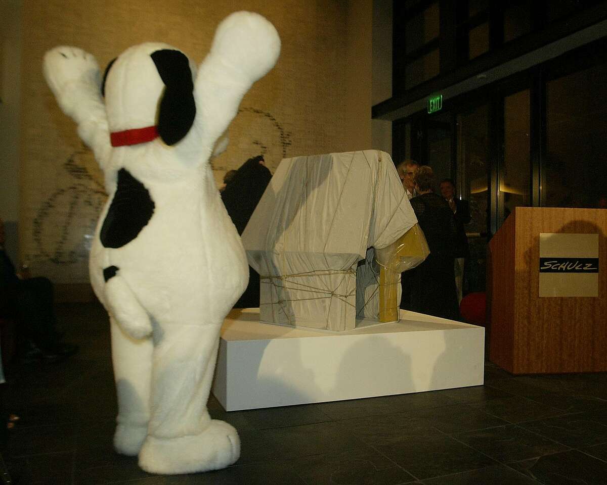 SNOOPY_039_OHARA.JPG Charles SChulz Museum 2301 Hardies Lane, Santa Rosa,CA. Snoopy ( Judy Sladky) praises the new piece of Art. A dog house wrapped up. Christo and Jeanne-Claude (Christo's wife) present "wrapped Snoopy House" at the Charles Schult Museum Photo/John O'Hara Ran on: 07-02-2006 Snoopy (a costumed Judy Sladky) hails Christo and Jeanne-Claudes wrapped Snoopy house.