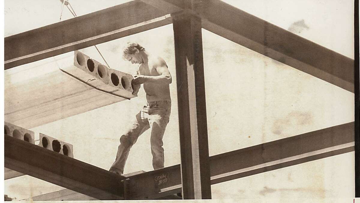 John Mazzuchelli guides a piece of pre-cast concrete onto steel beams to form a new roof on the fourth floor of the Mews on Arch Street on June 13, 1984. The new fourth floor of the assisted living facility was to include 27 rooms.