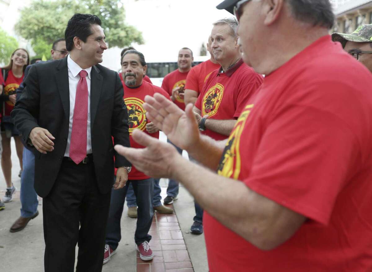 San Antonio mayoral candidate Manuel Medina greets people Tuesday, March 21, 2017 at City Hall before receiving the endorsement of the San Antonio Professional Firefighters Association in a news conference on the city hall steps.