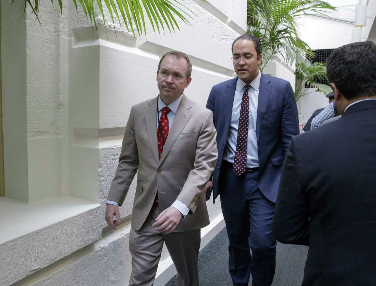 Budget Director Mick Mulvaney (left) and Rep. Will Hurd, R-San Antonio leave a meeting with President Donald Trump, who came to the Capitol to rally support for the overhaul.