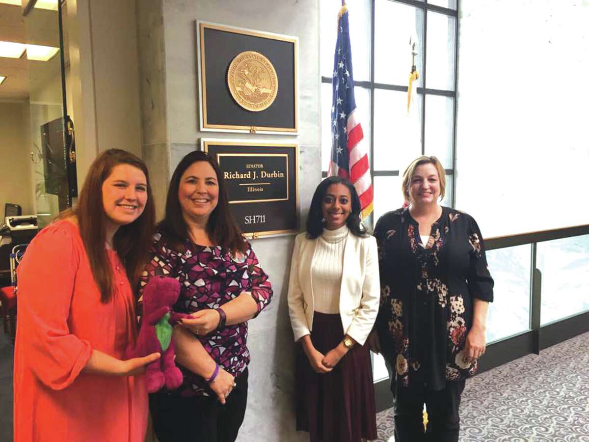 Kris Klenke, second from left, and her daughter Chelsey visit with staff members at U.S. Senator Dick Durbin's office in Washington, D.C. They are advocating for Mucopolysacchandosis, a rare disease that took the life of Klenke's son, Kraig.