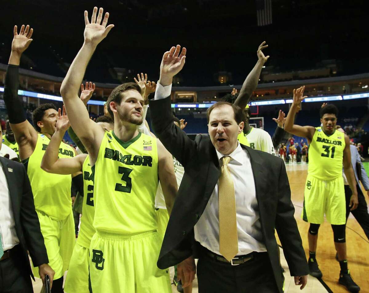 Baylor coach Scott Drew and his team wave to fans following a second-round game against Southern California in the NCAA Tournament in Tulsa, Okla., on March 19, 2017. Baylor won 82-78.