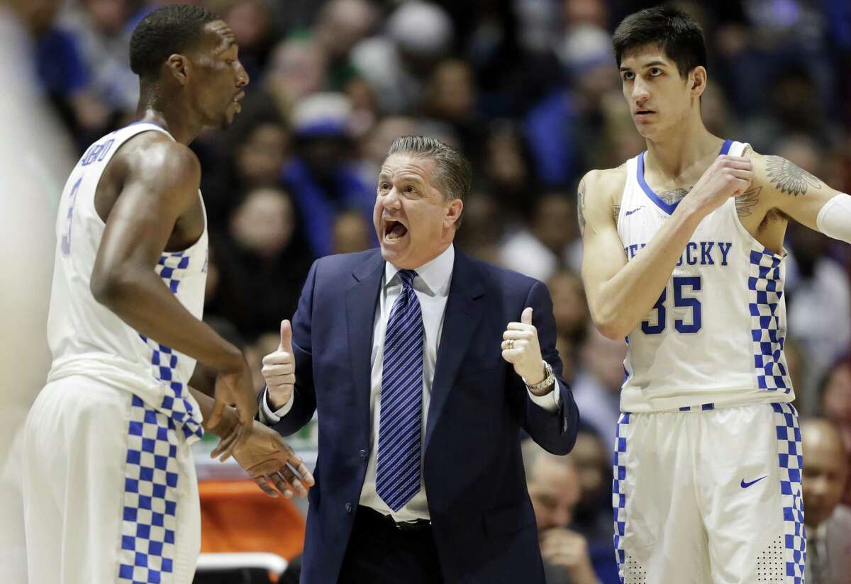 Kentucky coach John Calipari talks to Edrice Adebayo (3) and Derek Willis (35) converse in the first half against Alabama in the semifinals of the Southeastern Conference tournament in Nashville, Tenn., on March 11, 2017.