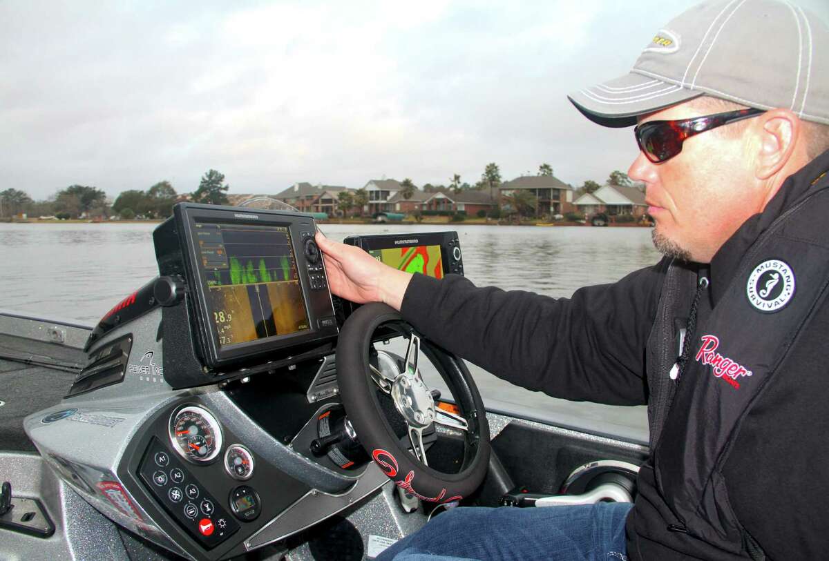 Professional bass tournament angler Keith Combs uses some of his boat’s extensive marine electronics to help locate potential fishing areas while scouting Lake Conroe, site of the 2017 Bassmaster Classic world bass fishing championship this March.