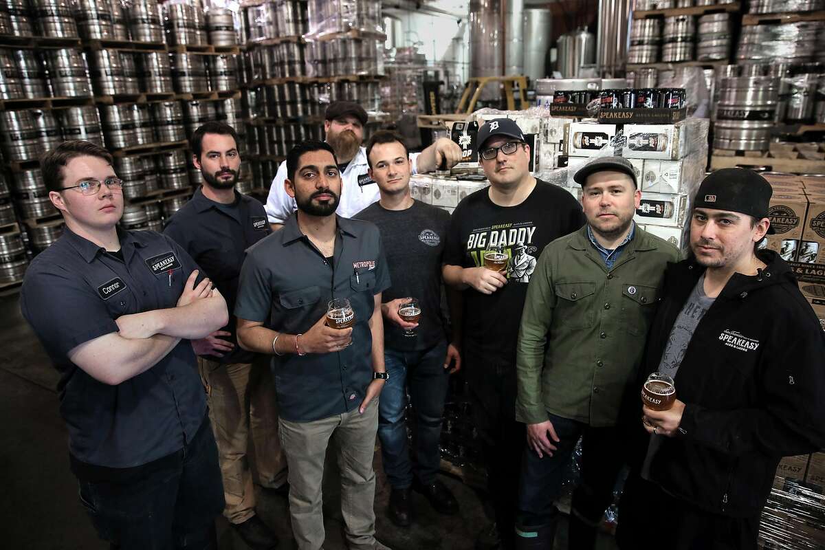 During the transition period before the sale to Hunters Point Brewery, Speakeasy's staff was down to eight. From left: cellar worker Connor Bross, brewer Clay Jordan, controller Raman Sharma, cellar worker Rick Schmidt, supply chain manager Andrew Swatzell, public relations director Brian Stechschulte, brewer Josh Benedict and cellar worker Zack Farwell.