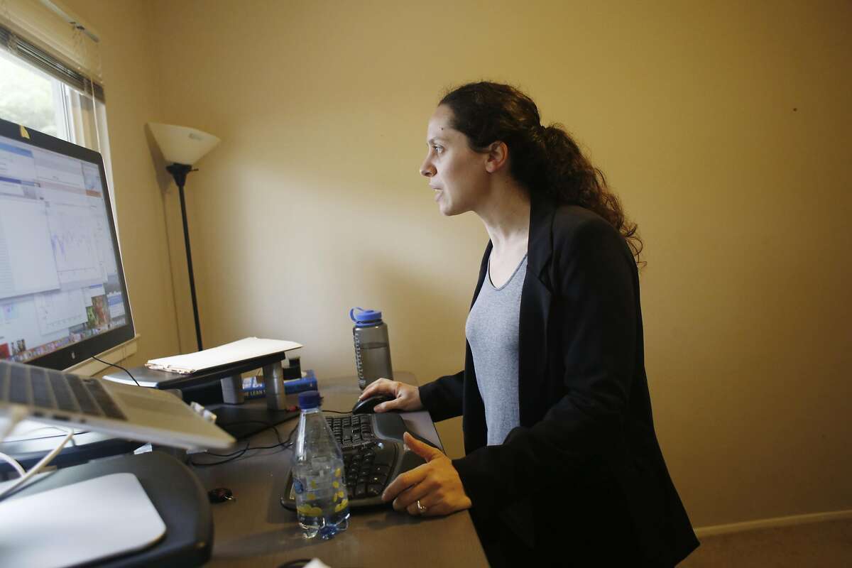 Lolly Mitchell of Redwood City works on her computer, one of the last items in the room on Wednesday, March 22, 2017 in Redwood City, Calif. Mitchell is in the midst of moving to a new home in Southern California.
