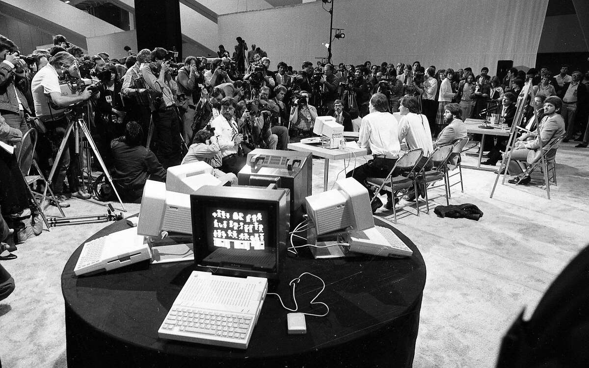 Apple executives John Sculley, Steve Jobs and Steve Wozniak introduce the Apple Iic at the "Apple II Forever" event at Moscone Center in San Francisco on April 23, 1984.