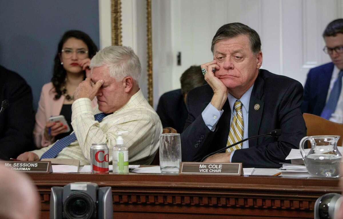 After eight hours of debate, House Rules Committee Chairman Rep. Pete Sessions, R-Texas, left, and Rep. Tom Cole, R-Okla., the vice-chair, listen to arguments from committee chairs. ﻿